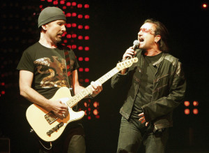 LAS VEGAS - NOVEMBER 04:  U2 guitarist The Edge (L) and singer Bono perform during the first of two sold-out shows of their "Vertigo" tour at the MGM Grand Garden Arena November 4, 2005 in Las Vegas, Nevada. The band is touring in support of the album "How To Dismantle An Atomic Bomb."  (Photo by Ethan Miller/Getty Images)